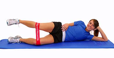 Supine bridge with resisted hip abduction. The patient places the
